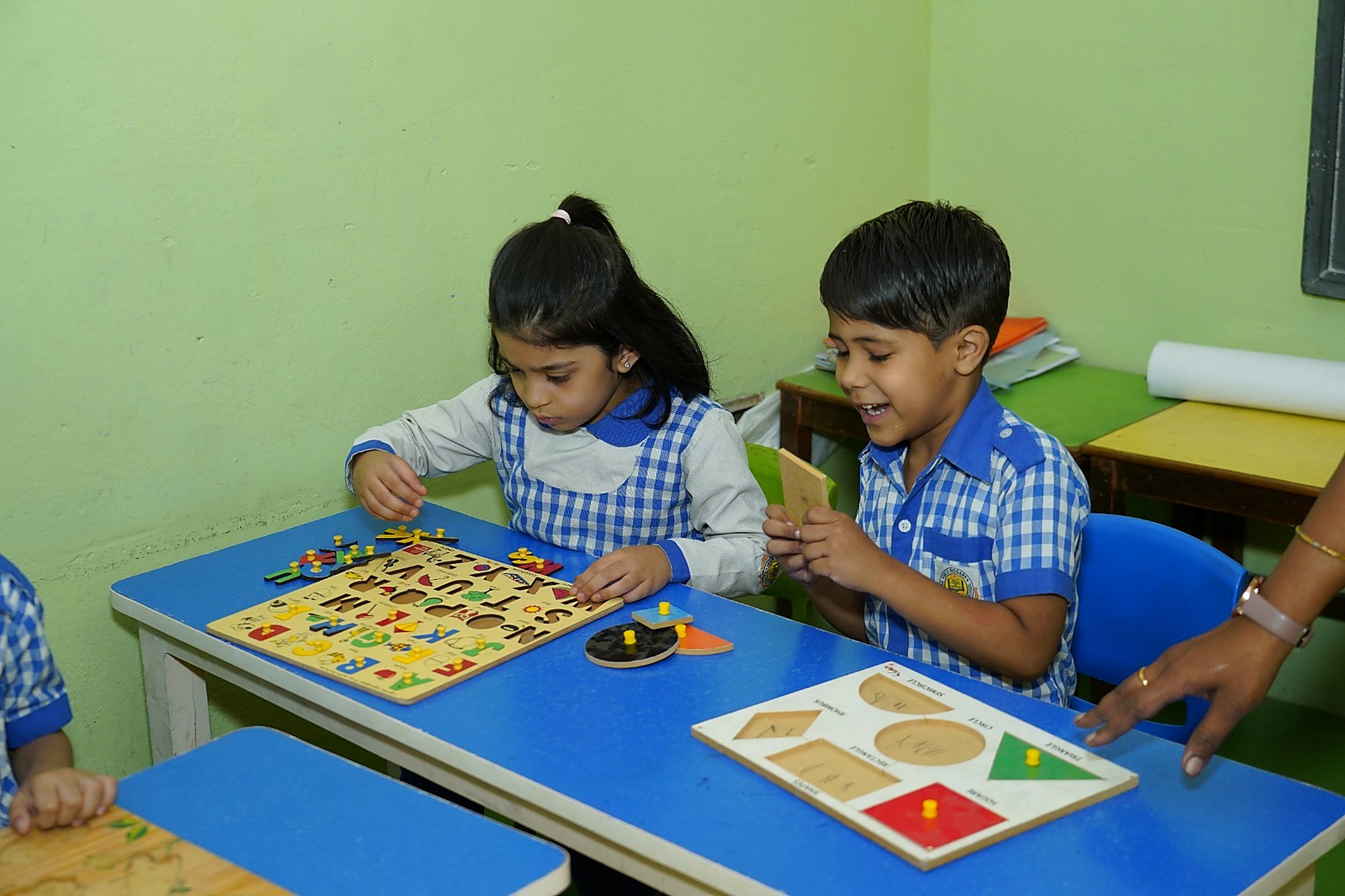 Children learning with hands-on puzzles